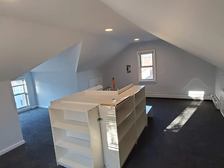 The finished attic makes a great office away from the noise, or a dream bedroom for a kid.