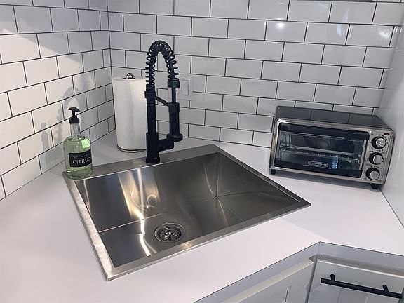 New matt black & stainless steel telescoping faucet and deep stainless steel sink