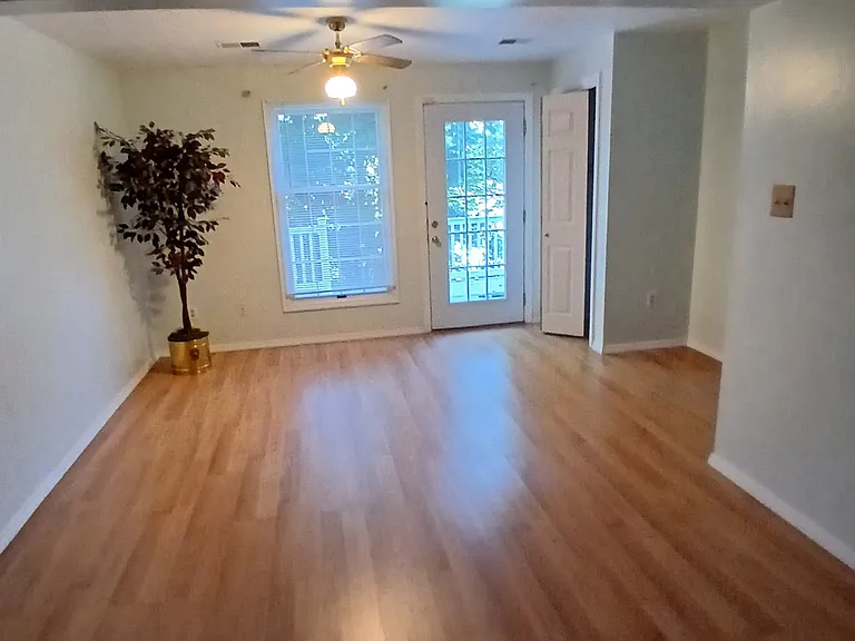 Downstairs room has coat closet and large storage closet underneath the steps.