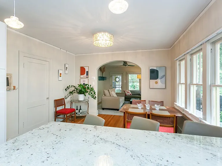 This huge granite island adjacent to the large dining room windows is great for preparing food, entertaining the family or working!