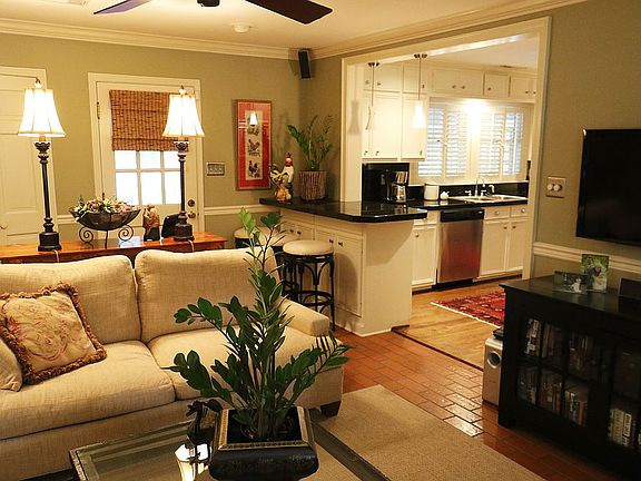 Den flows into kitchen