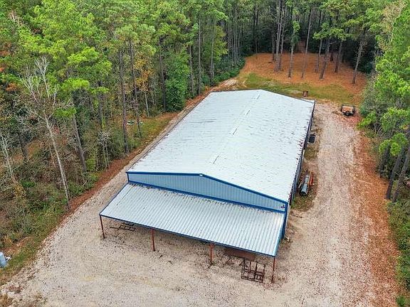 100' X 60' Barn-dominium, both north and south ends have 16' overhang, the south side ready to store exterior vehicles, could be a stable or more activity areas.