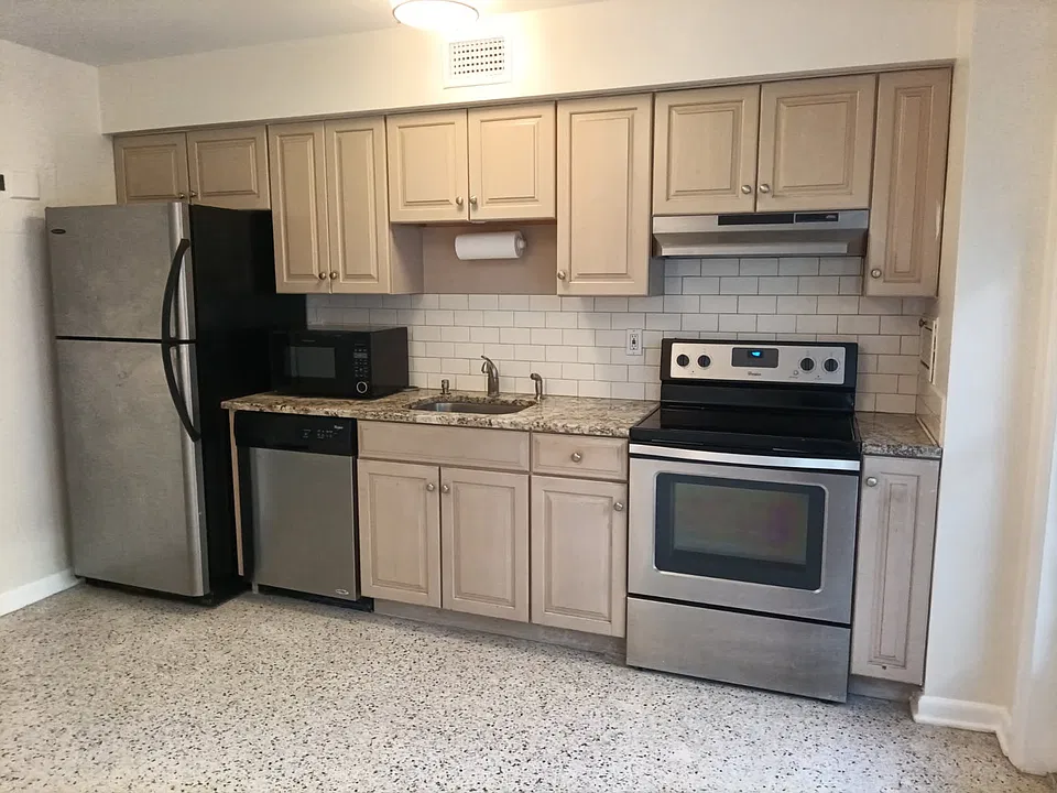 Updated Kitchen features SS Appliances, Granite Counter, Microwave and Dishwasher