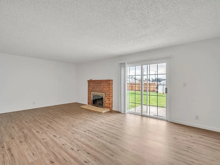 Dining/Living Room with fireplace.