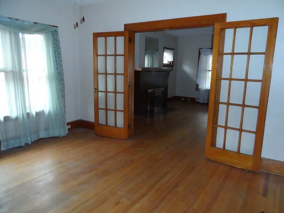 French doors connecting large living and dining rooms