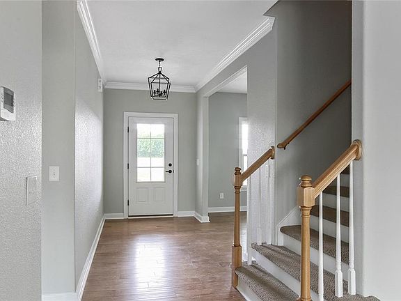 PHOTOS OF SIMILAR HOME. TO BE BUILT, approx 7 months to complete. BUYER CAN MAKE SELECTIONS. View of Entry Way. LVP/wood flooring on the first floor to include Entry, Dining Room, Great Room, Half Bath, and Eat in Kitchen.