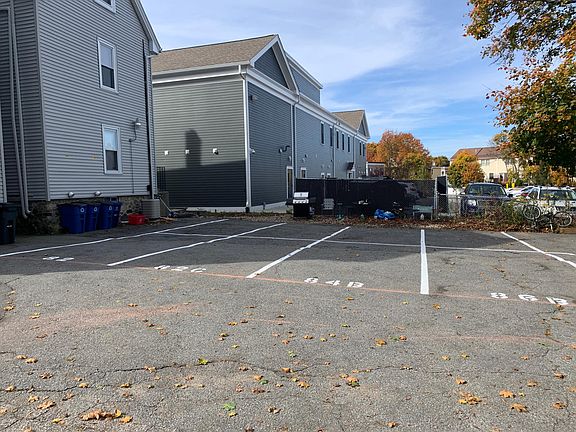 Parking lot with two assigned, tandem parking spots