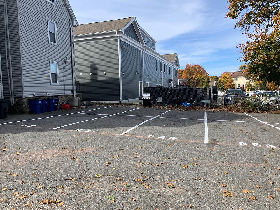 Parking lot with two assigned, tandem parking spots