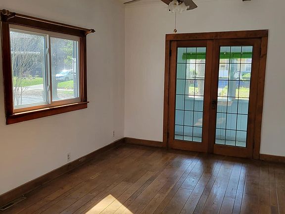 Patio doors opening onto front enclosed porch