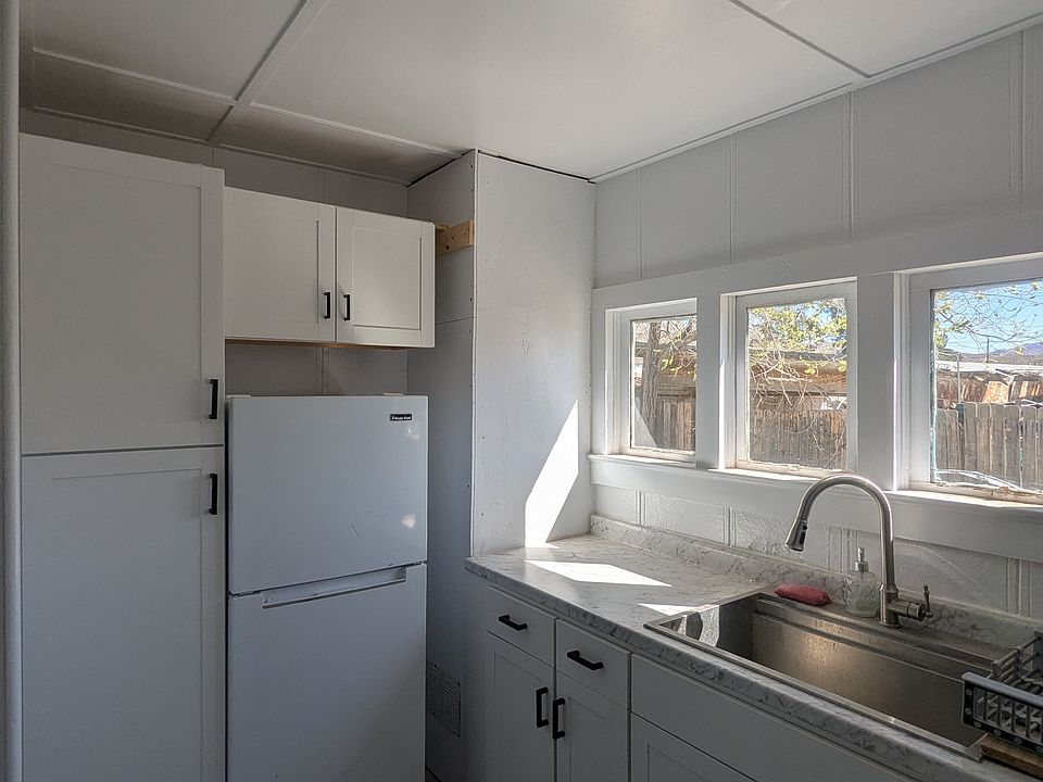 Remodeled kitchen includes loads of storage, refrigerator and oven