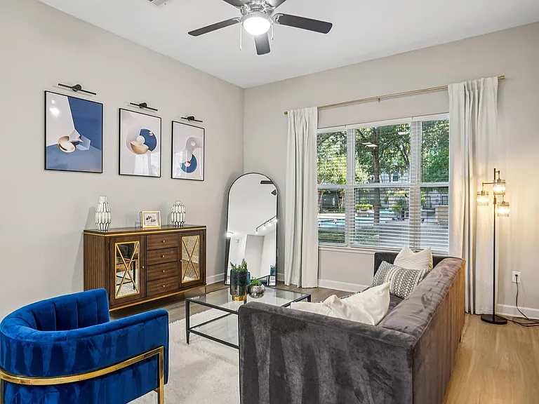 Relax in the bright and modern living room at Addison Keller Springs, your premier Addison, TX apartment home.
