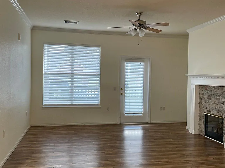 Spacious living room space with all new blinds