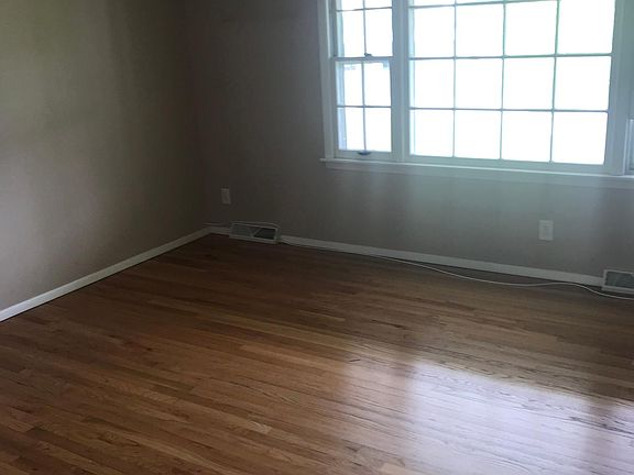 Nice living room view. Will all be painted soon.