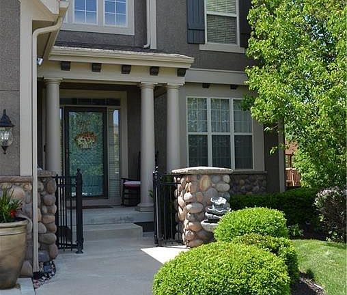 How unique! Stone accents and a gated entryway add to the charm of this home.
