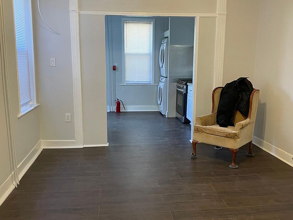 View of living room and kitchen (from the entrance door)