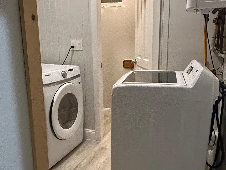 Dedicated laundry area with washer and dryer, and 1. extra toilconvenient for everyday use and easy access from the hallway.