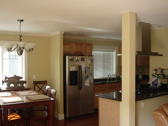 View of kitchen and eating area from french doors.