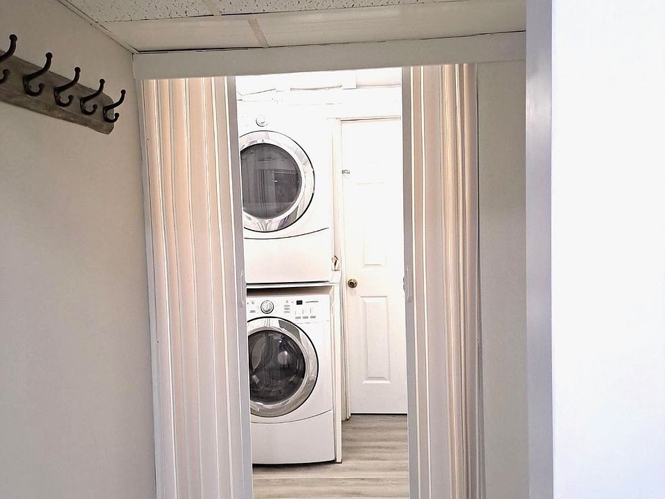 Laundry room with HE steam washer and dryer.
