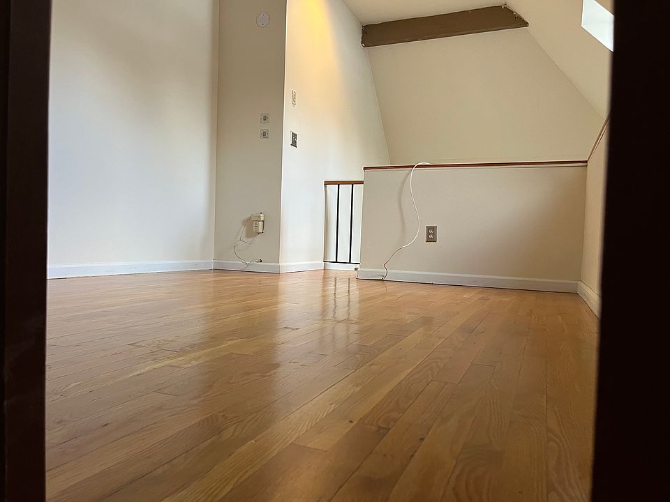 Loft bedroom overlooking the living area