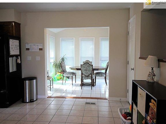 Sunroom at back of kitchen and one pantry of two pantries off to the right.  Kitchen has enough space for table if desired.