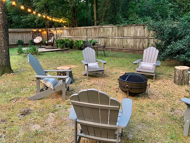 Backyard with string lights and fireppit