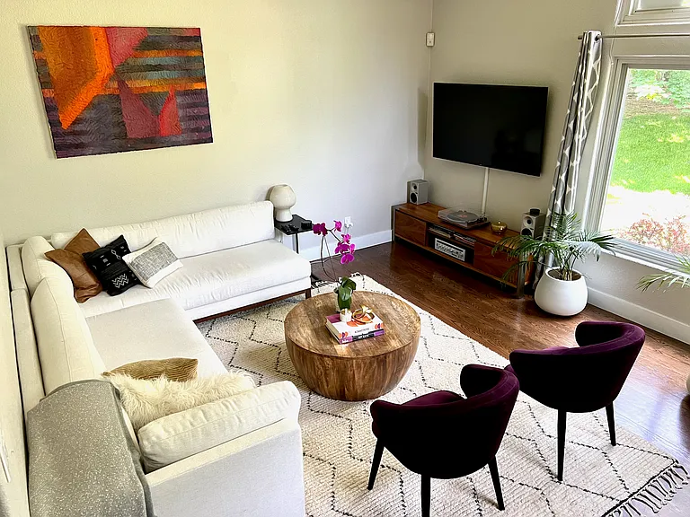 Another view of the comfortably sized tv living room. Windows throughout the house make this home so bright and welcoming!