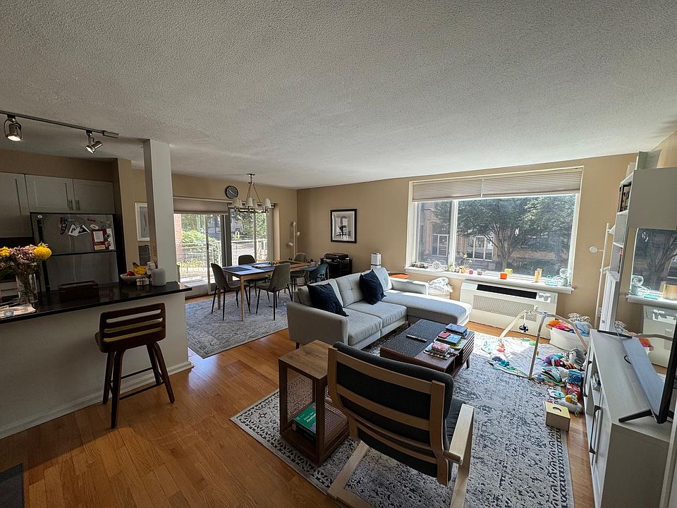 Open concept kitchen and living room with lots of light.
