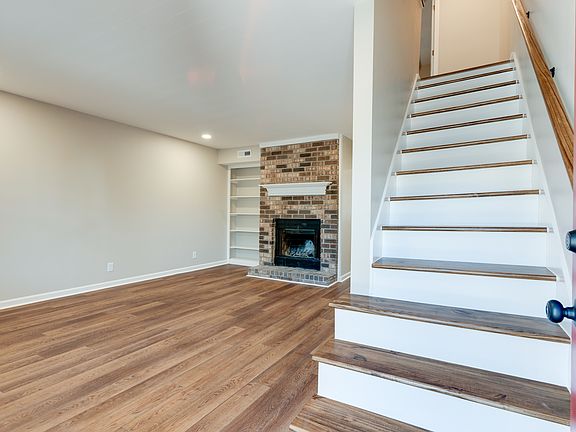 Beautiful entry with custom stained hardwood stairs