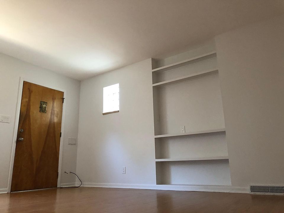 Entryway with built-in for books and tv