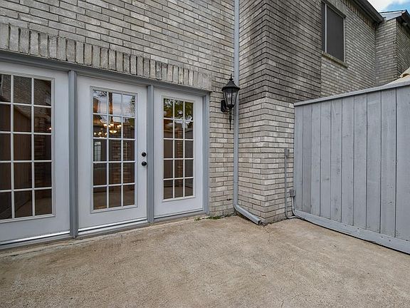 Private fenced patio with french door leading to Living Room.