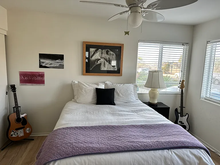 Bedroom 2 is downstairs, facing the front of the house, and light/bright!