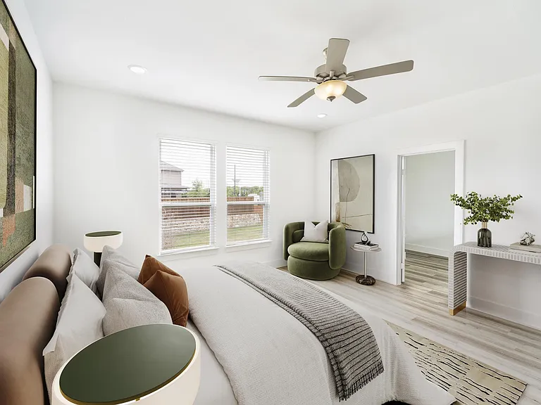 One of four stylish bedrooms in this single-family home at Amavi Celina. The design combines soft tones and natural light for an inviting, elevated feel.
