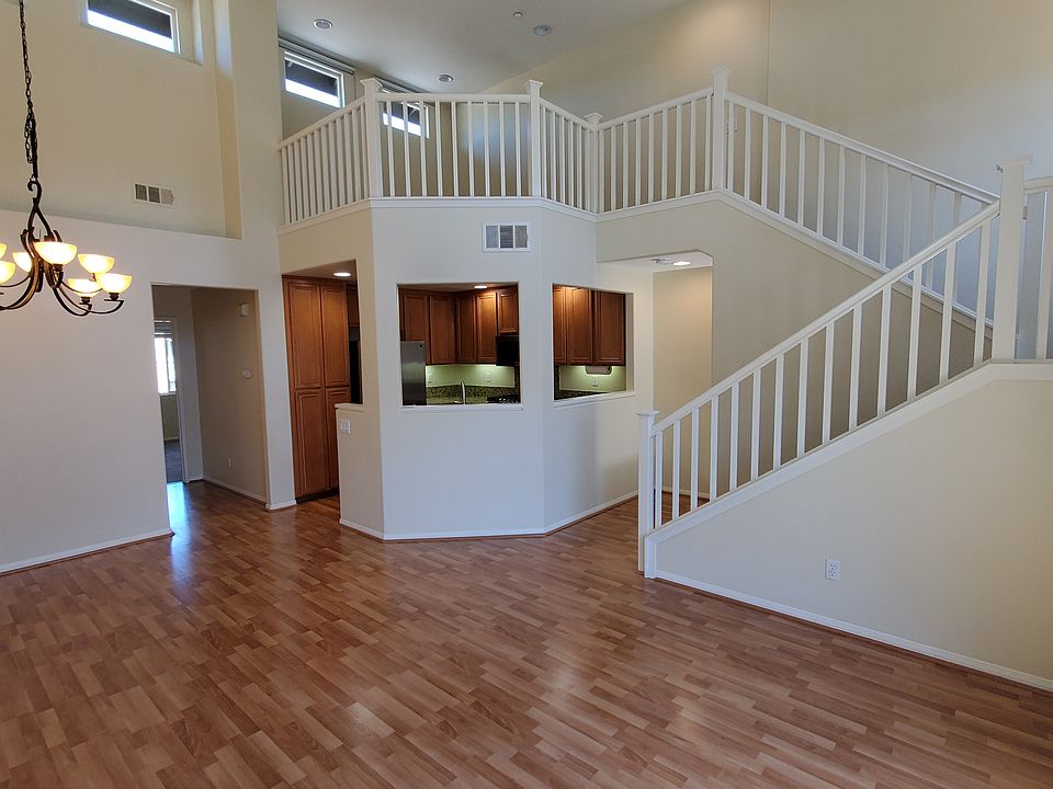 Living room and dining and kitchen and loft