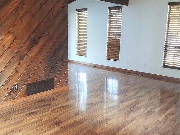 Living room with dining area around the corner (photo taken from front entrance)