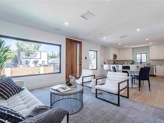 Open concept living, dining, and kitchen space.