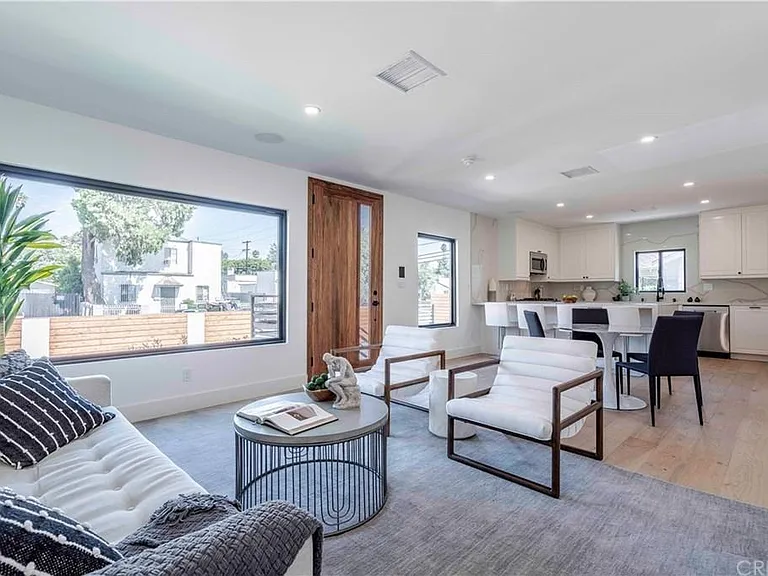 Open concept living, dining, and kitchen space.