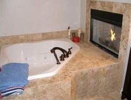 Master Bath with whirlpool tub, separate shower, dual sinks and fireplace