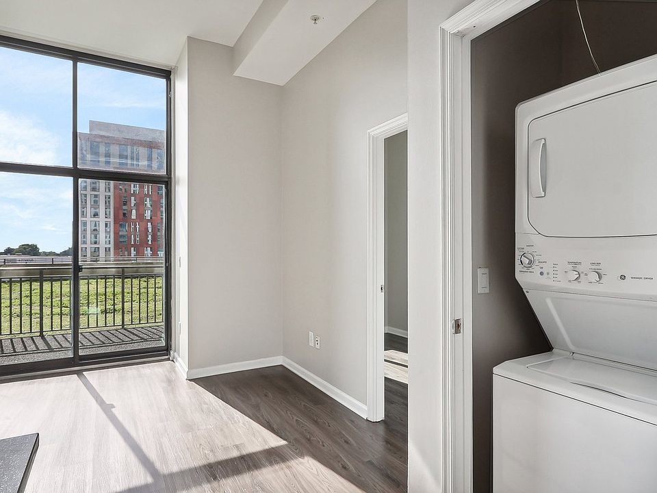 washer and dryer next to a window