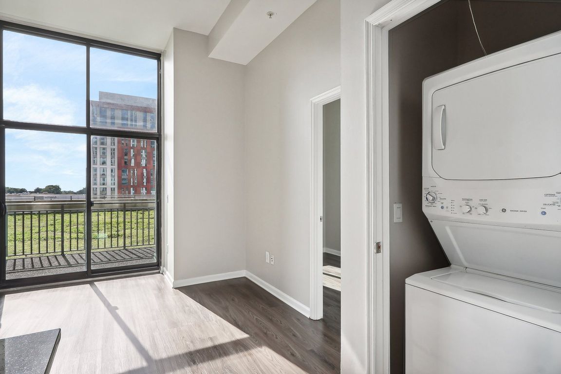washer and dryer next to a window