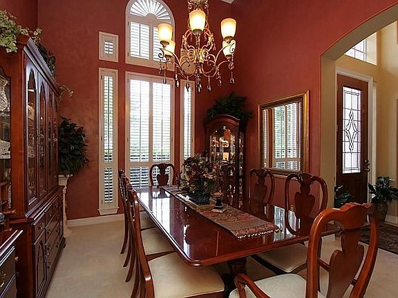 Formal dining to left of entry with faux paint finish and plantation shutters