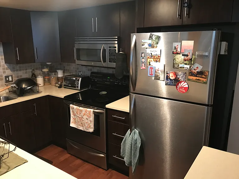 Electric stove, oven, and microwave with recirculating range hood.