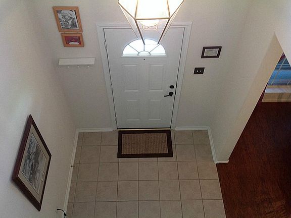 The entryway is visible from the upstairs game room. I guess this is the way to change the bulbs- ju