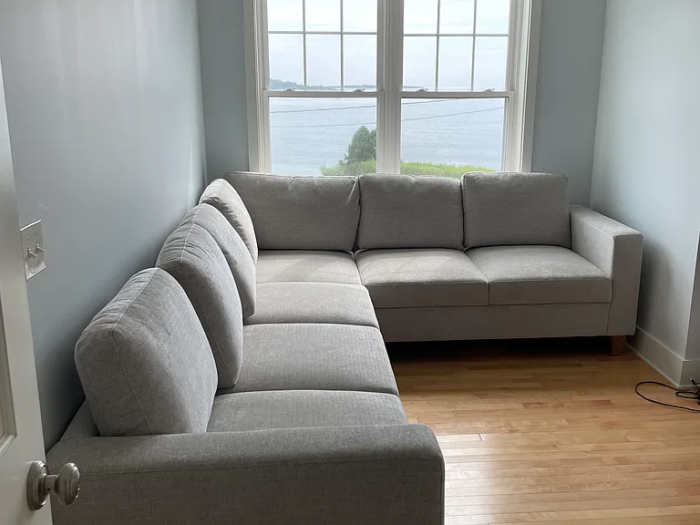 Upstairs sectional that pulls out to queen bed with tv across and incredible bay views.