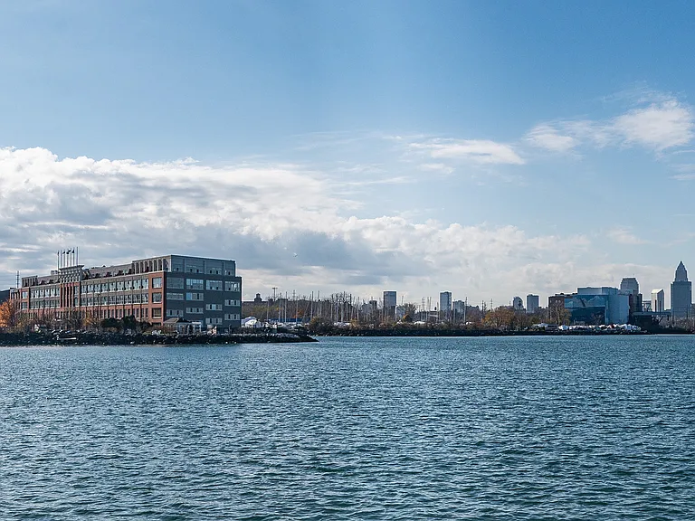 Charming waterfront building with picturesque city skyline views