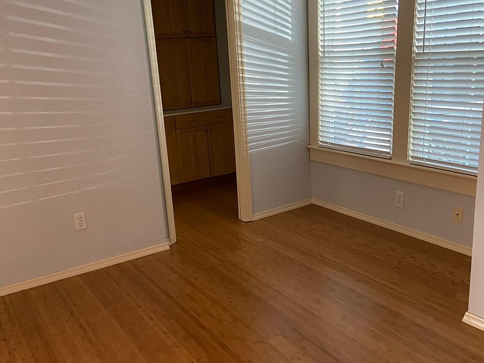 Bedroom view toward second closet and bathroom entrance.
