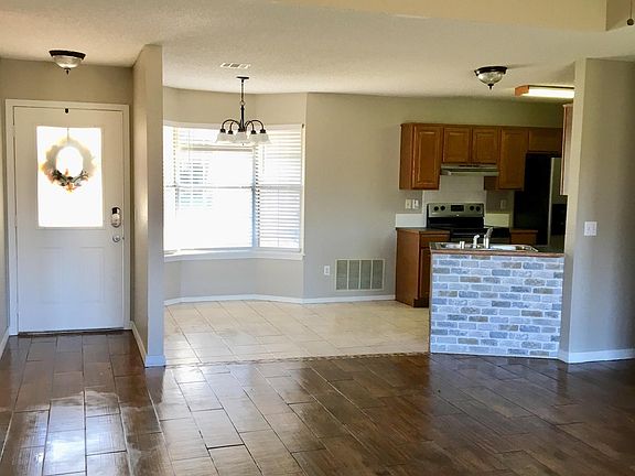 Open floor plan with eat-in kitchen