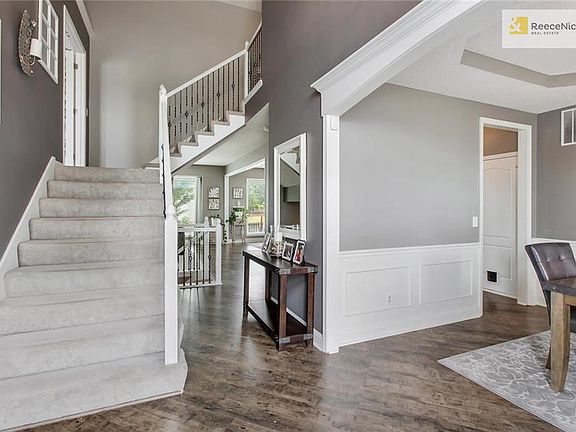 The staircase leads to the 2nd story bedrooms and a bonus room at the first landing!