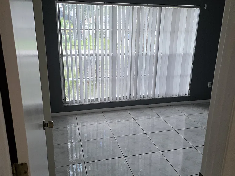 bedroom 2 which has beautiful window showing landscape of front of house