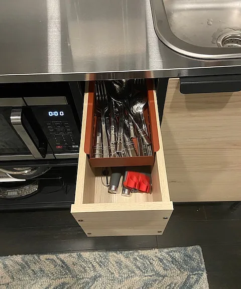 Complete set of flatware along with kitchen basics, can opener, peelers, and more.