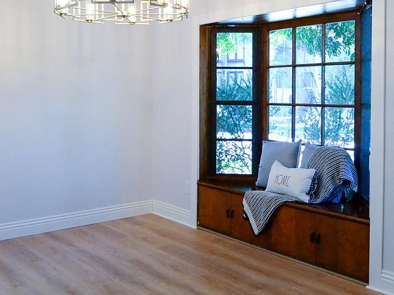 Dining room with Bay window with treetop views
